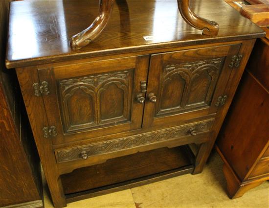 Tudor style carved oak panelled cupboard